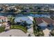 Waterfront property with lush landscaping and circular driveway at 2807 Sancho Panza Ct, Punta Gorda, FL 33950