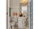 Clean and bright half bathroom with white vanity and updated fixtures at 2807 Sancho Panza Ct, Punta Gorda, FL 33950