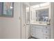 Clean bathroom with single sink vanity and mirrored medicine cabinet at 2807 Sancho Panza Ct, Punta Gorda, FL 33950