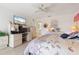 Spacious bedroom with large bed, dresser, and home office area at 2807 Sancho Panza Ct, Punta Gorda, FL 33950