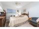 Cozy bedroom with queen-size bed and sitting area at 2807 Sancho Panza Ct, Punta Gorda, FL 33950