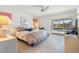 Bright bedroom with water view and king-size bed at 2807 Sancho Panza Ct, Punta Gorda, FL 33950