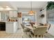 Kitchen dining area with pool view and light-toned furnishings at 2807 Sancho Panza Ct, Punta Gorda, FL 33950
