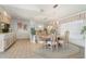 Elegant dining room with a round table and chandelier at 2807 Sancho Panza Ct, Punta Gorda, FL 33950