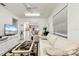 Comfortable Gathering room with light colored sofa and view of kitchen at 2807 Sancho Panza Ct, Punta Gorda, FL 33950