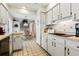 Eat-in kitchen boasts stainless steel appliances and tiled floor at 2807 Sancho Panza Ct, Punta Gorda, FL 33950