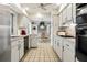Eat-in kitchen with stainless steel appliances and tiled floor at 2807 Sancho Panza Ct, Punta Gorda, FL 33950