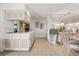 Bright kitchen with white cabinets and tiled floor at 2807 Sancho Panza Ct, Punta Gorda, FL 33950