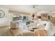Open living space with large sectional sofa and glass coffee table at 2807 Sancho Panza Ct, Punta Gorda, FL 33950