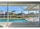 Inviting pool area with canal view and patio at 2807 Sancho Panza Ct, Punta Gorda, FL 33950