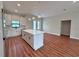 Open concept kitchen with island and hardwood flooring at 2920 Barry Rd, North Port, FL 34286