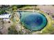 Aerial view of a natural spring with people swimming and relaxing at 325 San Benito Ave, North Port, FL 34287