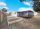 Backyard oasis with raised garden beds, screened patio and firepit at 325 San Benito Ave, North Port, FL 34287