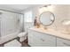 Updated bathroom features a white vanity, walk-in shower, and stylish fixtures at 325 San Benito Ave, North Port, FL 34287