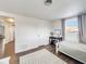 Bedroom with a twin bed, desk, and access to other rooms at 325 San Benito Ave, North Port, FL 34287