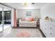 Charming bedroom with daybed, white dresser, and pink rug at 325 San Benito Ave, North Port, FL 34287
