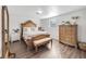 Spacious bedroom with large wooden bed frame and ample closet space at 325 San Benito Ave, North Port, FL 34287