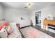 Bedroom with daybed, dresser, and view into kitchen at 325 San Benito Ave, North Port, FL 34287