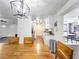 Bright dining room with a large wooden table and view into the kitchen at 325 San Benito Ave, North Port, FL 34287