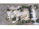 Aerial view of dog park, showing fenced area, paths, and shaded structures at 325 San Benito Ave, North Port, FL 34287