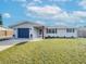 Newly renovated home with a modern facade and well-manicured lawn at 325 San Benito Ave, North Port, FL 34287