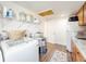 Laundry room features a sink, cabinets, and shelving at 325 San Benito Ave, North Port, FL 34287