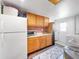Laundry room with washer, dryer, and kitchen-style cabinets at 325 San Benito Ave, North Port, FL 34287