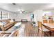 Bright living area with hardwood floors and views of the dining area at 325 San Benito Ave, North Port, FL 34287