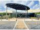 Morgan Gathering Community Center entrance, featuring a modern design and covered walkway at 325 San Benito Ave, North Port, FL 34287