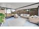 Relaxing screened porch with wicker furniture and a view of the backyard at 325 San Benito Ave, North Port, FL 34287