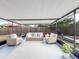 Relaxing screened porch with wicker furniture at 325 San Benito Ave, North Port, FL 34287