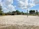 Beach volleyball court with sand and net, ready for some friendly competition at 325 San Benito Ave, North Port, FL 34287