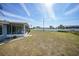Large backyard with grassy area at 334 Skylark Nw Ln, Port Charlotte, FL 33952