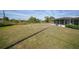 Large grassy backyard with a bird bath at 334 Skylark Nw Ln, Port Charlotte, FL 33952