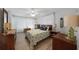 Bedroom with large windows, and coastal bedding at 334 Skylark Nw Ln, Port Charlotte, FL 33952
