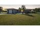 Single-story home with attached garage and landscaped yard at 334 Skylark Nw Ln, Port Charlotte, FL 33952