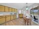 Kitchen with yellow cabinets, ample counter space, and breakfast nook at 334 Skylark Nw Ln, Port Charlotte, FL 33952