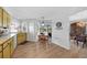 Kitchen with yellow cabinets, and access to the dining area at 334 Skylark Nw Ln, Port Charlotte, FL 33952