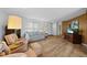 Bright living room featuring hardwood floors and comfy seating at 334 Skylark Nw Ln, Port Charlotte, FL 33952