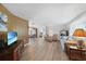 Open living space with hardwood floors, and view to dining area at 334 Skylark Nw Ln, Port Charlotte, FL 33952