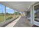 Screened patio with chairs and backyard view at 334 Skylark Nw Ln, Port Charlotte, FL 33952