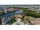 Elevated view of a home with lush landscaping and a serene waterfront location on a cul-de-sac at 3507 Marsala Ct, Punta Gorda, FL 33950