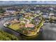 Aerial view of waterfront home with private dock, lush landscaping, and stunning water views at 3507 Marsala Ct, Punta Gorda, FL 33950