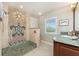 Bathroom with pebble tile shower and shuttered window at 3507 Marsala Ct, Punta Gorda, FL 33950