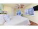Bedroom with ceiling fan, hardwood floors and sliding glass door at 3507 Marsala Ct, Punta Gorda, FL 33950