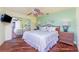 Bedroom with hardwood floors, ceiling fan and mirrored closet at 3507 Marsala Ct, Punta Gorda, FL 33950