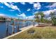 View of the private dock with boat lift on the canal behind the house at 3507 Marsala Ct, Punta Gorda, FL 33950