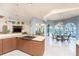 Bright kitchen seamlessly connecting to the dining area, with granite countertops and ample cabinet space at 3507 Marsala Ct, Punta Gorda, FL 33950