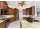 Well-equipped kitchen with stainless steel appliances, granite countertops, and custom cabinetry with ample storage at 3507 Marsala Ct, Punta Gorda, FL 33950