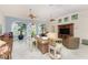 Bright living room with ceiling fans, tile flooring, and large windows offering plenty of natural light at 3507 Marsala Ct, Punta Gorda, FL 33950